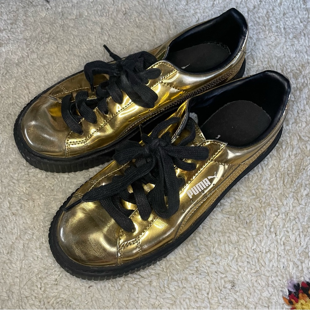 Gold and black puma creeper sneakers